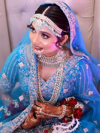 A happy Nikkah bride. Her smile and the radiant makeup make for a perfect picture.