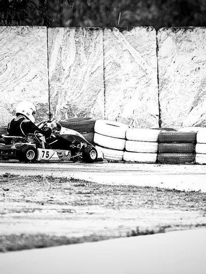 A black and white shot of our driver after a crash, showing the harsh realities of motorsport.
