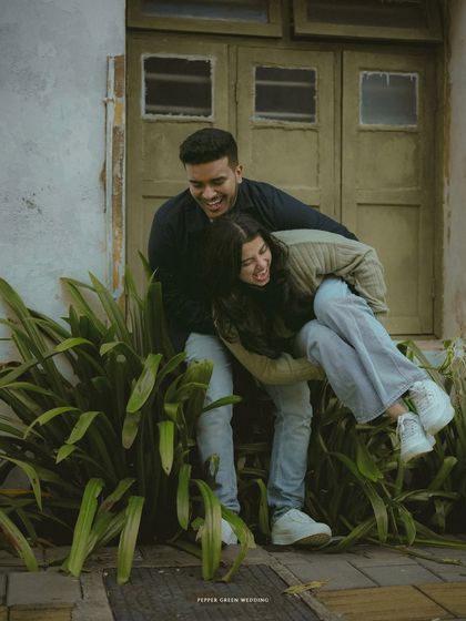 A playful piggyback ride captures the fun and carefree spirit of this couple during their urban pre-wedding shoot.