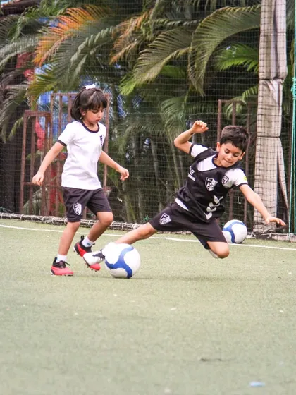 A player commits to a full-stretch tackle to win the ball, a moment of pure determination and passion for the game.