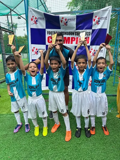 The Under-9 team celebrating their victory at the Monsoon Cup. Look at those happy faces.