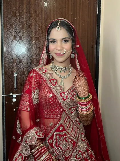 A full smile from this glowing bride. The makeup is designed to be bright and beautiful, perfect for celebrating her wedding day.