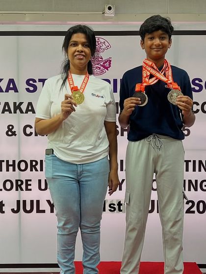Our Air Rifle champions, Kiaan and Gajalakshmi, on the podium at the Karnataka State Shooting Competition 2025, showcasing their hard-earned medals.
