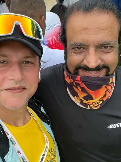 A member with a fellow runner at "The Daredevils" event. We love connecting with the larger running community at these races.