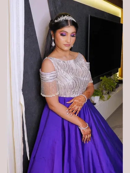 Another angle of this gorgeous Roka look, showing the full effect of the silver and purple gown. The makeup features a flawless airbrush finish to ensure she looks perfect from every angle all night long.