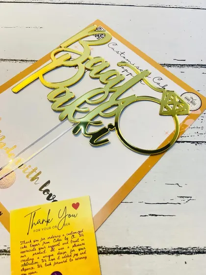 The "Baat Pakki" topper packaged with a thank you card, ready for an engagement celebration.