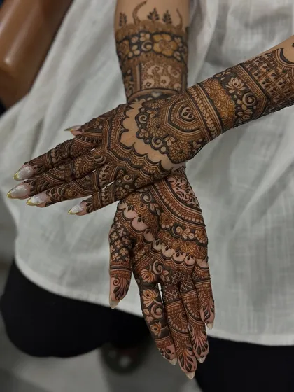 A crossed-hands pose to showcase the beautiful flow and symmetry of the design.