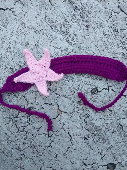 This starfish headband is the perfect accessory for a mermaid or beach-themed outfit. I crafted it with a pink starfish on a purple band, but I can customize the colors for you.