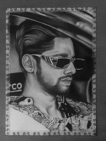 A step-by-step look at my 85-hour portrait of Baseer Ali. You can see the grid lines and how I build up the layers of graphite and charcoal to create a photorealistic effect.