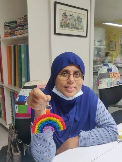 This participant created a vibrant rainbow keychain, showing off the neat stitches and bright colors.