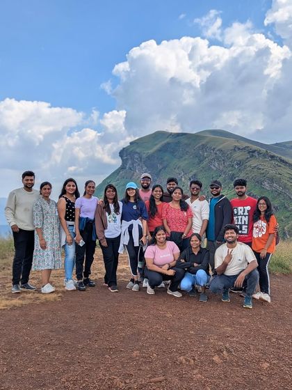A group photo from our "Explore Chikmagalur 2.0" trip, showcasing the beautiful landscape.