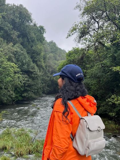 A trekker looking out at the Bhadra river from the Kurinjal trail.