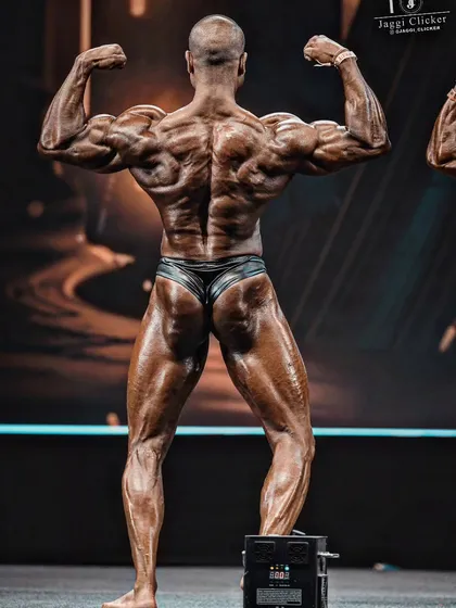 Your posterior chain, especially the hamstrings and glutes, fetches maximum marks. This is a shot from my pro-qualifier win, showcasing the level of conditioning and muscle separation required to dominate the back poses on a professional stage.