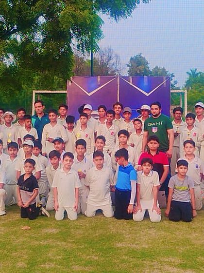 A group photo of our cricket team, united and proud after a successful tournament.