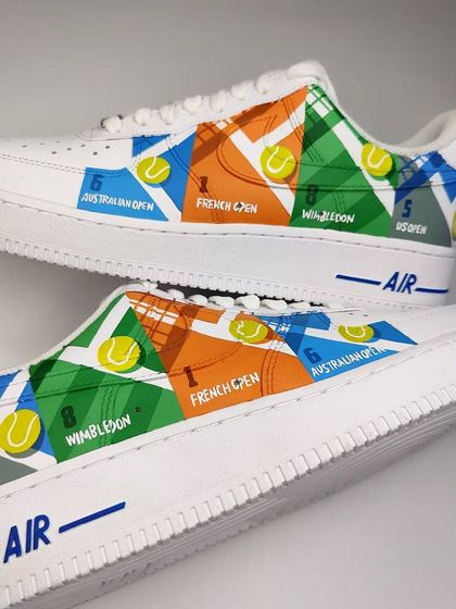 A full view of the "Grand Slam" side of the Federer sneakers. Each panel represents a different tournament: Australian Open, French Open, Wimbledon, and the US Open.