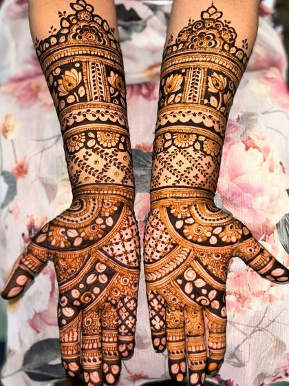 The same beautiful floral band design, showing the rich, dark stain of the natural henna.