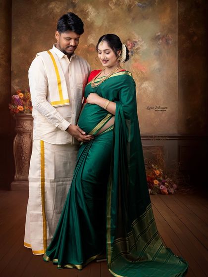 A full-length couple's portrait in traditional South Indian attire. The connection between them is the true focus of this elegant and culturally rich photograph.