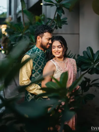An intimate couple shot. The focus is on their connection, with her makeup looking soft, romantic, and flawless.