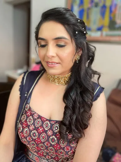 A close-up of the Sangeet ponytail, showing the delicate pearl accessories.