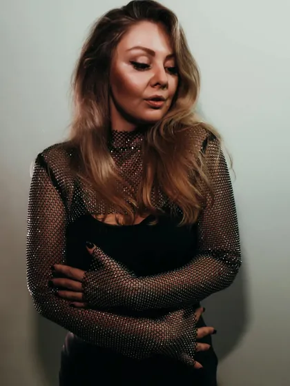 A close-up portrait with a mesh top, used for the promo of a techno takeover event in Delhi.