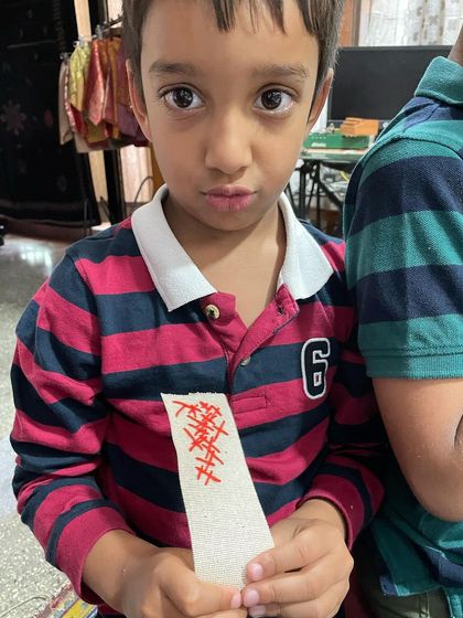 My 5-year-old grandson holding his first attempt at embroidery. Even the simplest stitches are a start, and he was so proud of his creation.