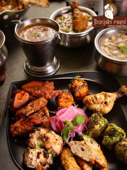 A true Punjabi feast is about abundance and variety. This spread, featuring a mix of our signature tandoori kebabs, rich Dal Makhani, and hearty curries, shows the kind of lavish and satisfying meal we can create for your event.