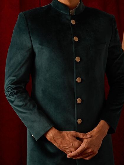 The clean silhouette of our velvet bandhgala. The focus is on the perfect fit and the luxurious fabric, creating a look of understated power.