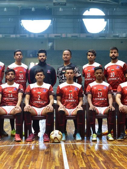 A formal team photograph of a futsal club on our court. The professional setting is perfect for official team photoshoots and media days.