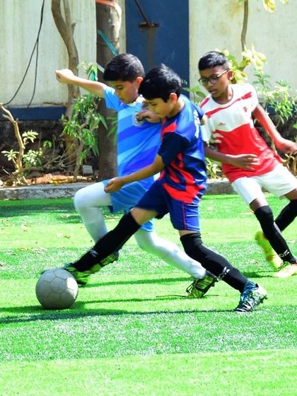 Young players showcasing their dribbling and tackling skills. Our grassroots football program is all about developing these fundamentals.
