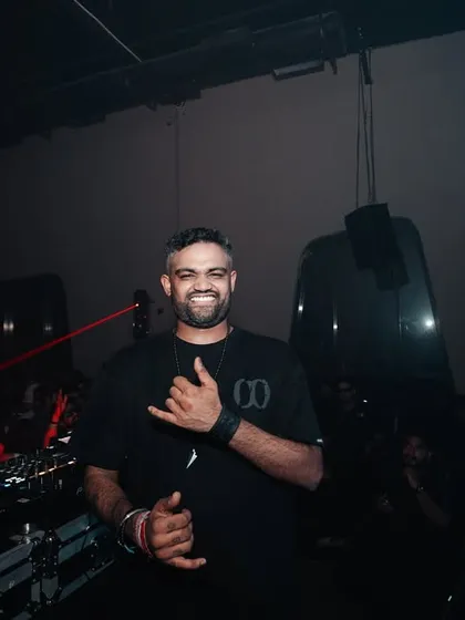 A smiling, candid shot of me after a great set, giving a shaka sign to the camera.