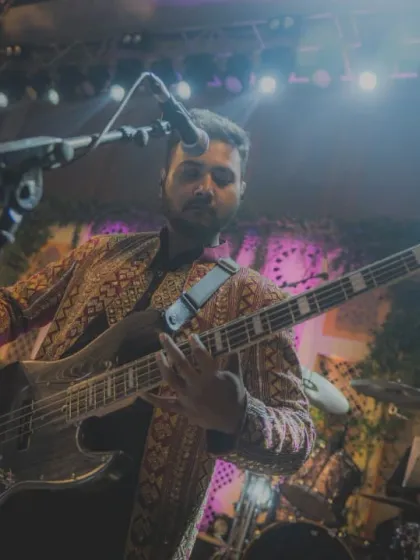 Our bassist, framed by the impressive stage lighting at the ITC Royal Bengal.