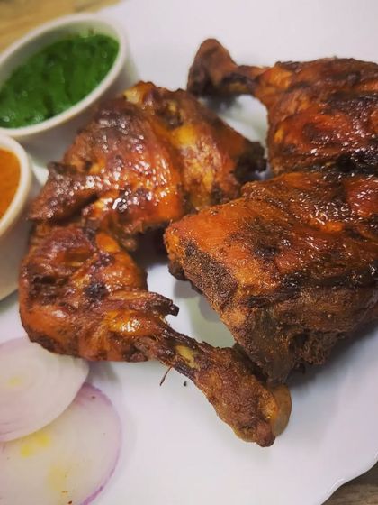 My homemade Chicken Tandoori, marinated in yogurt and spices for a deep, authentic flavor without any artificial colors. The chicken is juicy on the inside and perfectly charred on the outside.