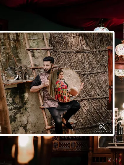 A creative pre-wedding portrait using a mirror to reflect the bride. This artistic shot adds a layer of storytelling to the traditional Punjabi village theme.