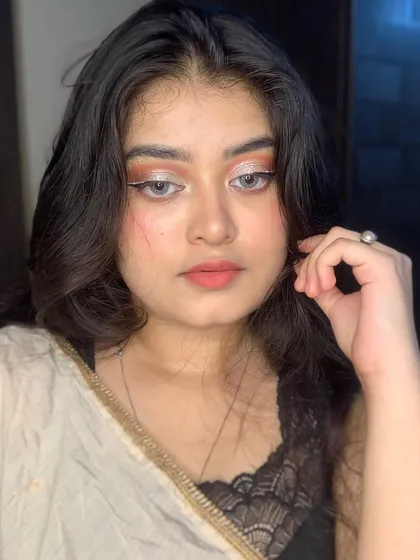 A soft glam look with a silver cut crease and a subtle white graphic liner for extra definition.