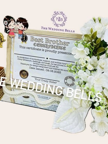 Our limited edition "Best Brother" trophy hamper, complete with a personalized certificate and a royal white floral arrangement on a mirror base. It's more than a gift, it's an emotion.