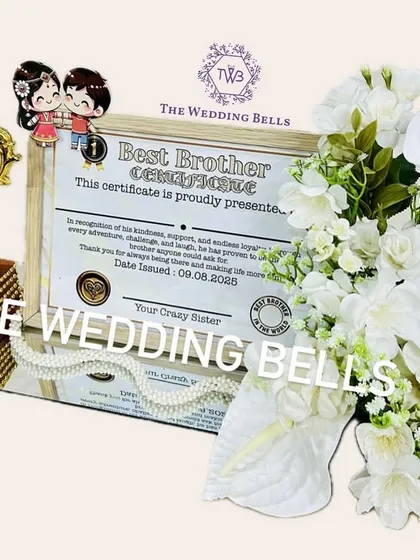 Our limited edition "Best Brother" trophy hamper, complete with a personalized certificate and a royal white floral arrangement on a mirror base. It's more than a gift, it's an emotion.
