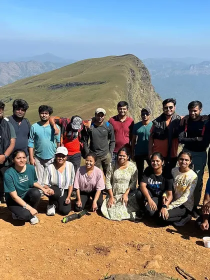 The New Year's trekking batch posing for a group photo on the sunny slopes of Nethravathi.