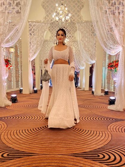 A classic all-white Chikankari outfit. This timeless and elegant look is perfect for daytime weddings or formal evening events.