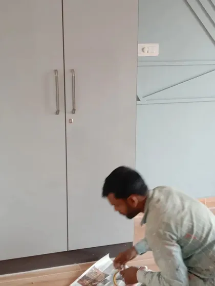 A member of my team at work. We ensure that even the flooring is protected during the finishing process, reflecting my commitment to a clean worksite.