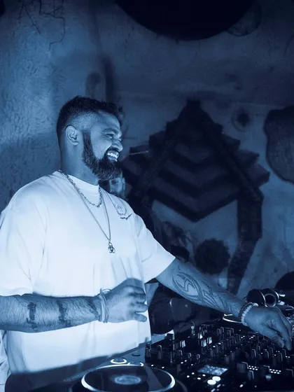 A smiling, happy shot of me at the decks, bathed in cool blue light.
