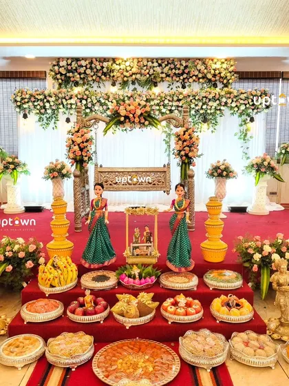 I handle traditional ceremonies with care and attention to detail. This naming ceremony stage features a beautifully decorated floral cradle, traditional dolls, and an array of offerings, creating a perfect blend of celebration and custom.