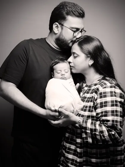 There is nothing more powerful than the love of new parents. This timeless black and white portrait captures that gentle, protective embrace during a newborn family session.