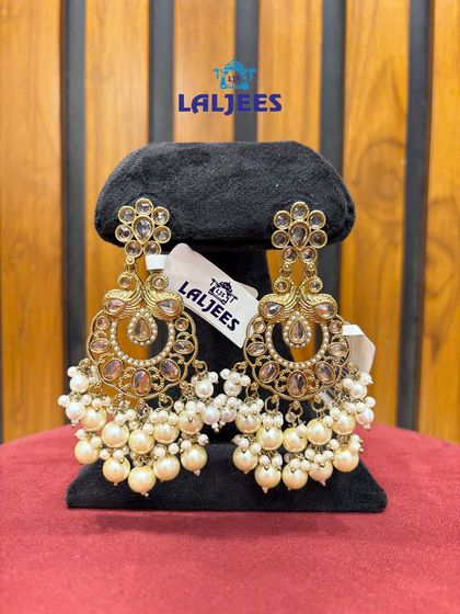 Elegant chandbali earrings with pearl clusters. These are lightweight and can be paired with both traditional and modern outfits.