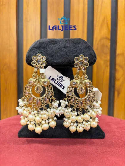 Elegant chandbali earrings with pearl clusters. These are lightweight and can be paired with both traditional and modern outfits.