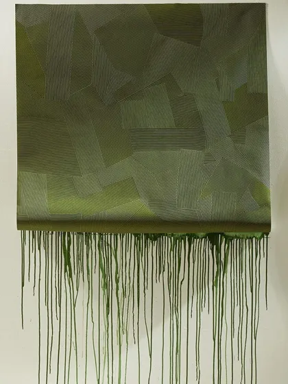 An artistic representation of our Combed Plaster collection. The green vinyl wallcovering, dripping with paint, highlights the texture and color, showcasing its potential as a canvas for further creative expression.