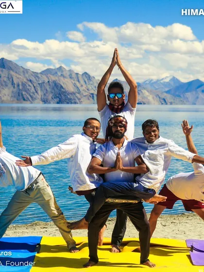 This is more than just a workout, it's an adventure. Here, I'm with my students in the Himalayas, creating a group yoga pose against the stunning backdrop of Pangong Lake. We take fitness beyond the studio walls.