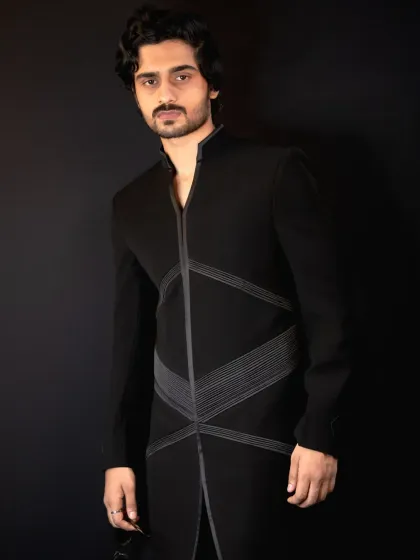 A closer look at the 'Grooved Lines' jacket. The detailed paneling and front zipper create a contemporary aesthetic perfect for a cocktail or sangeet event.