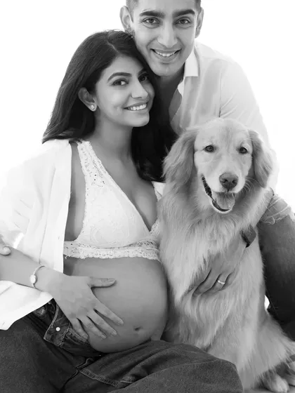 In black and white, emotion takes center stage. This timeless family portrait with their beloved pet strips away all distractions, focusing purely on the connection and love that binds them together.