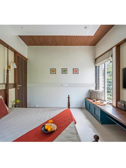 A bedroom that beautifully blends traditional Indian aesthetics with modern comforts. We used rich wood tones, a classic four-poster bed frame, and culturally inspired artwork to create a warm, inviting, and personalized sanctuary.