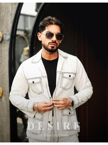 Another view of the all-white jacket, showing the perfect fit and the modern, minimalist design.